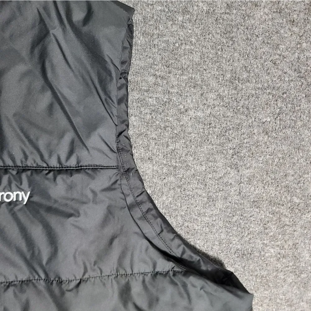 Premium insulated puffer vest by The North Face featuring embroidered Synchrony